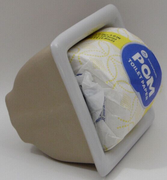 Recessed Ceramic TP holder with toilet paper shown in it